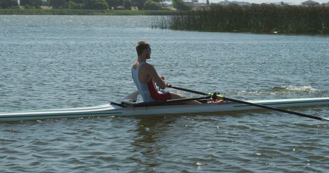 Solo Rower Paddling Canoe on Tranquil River - Download Free Stock Images Pikwizard.com
