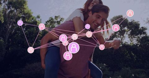 Couple playing in park carrying partner, social network overlay showing online connections