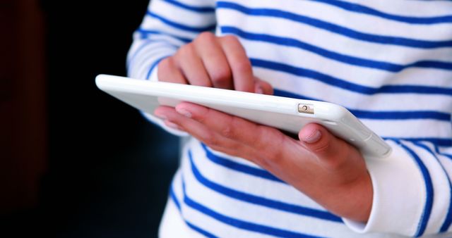 Person Interacting with Tablet in Blue Striped Shirt - Download Free Stock Images Pikwizard.com