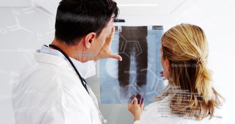 Doctors Analyzing X-Ray with Futuristic Technology Overlay - Download Free Stock Images Pikwizard.com