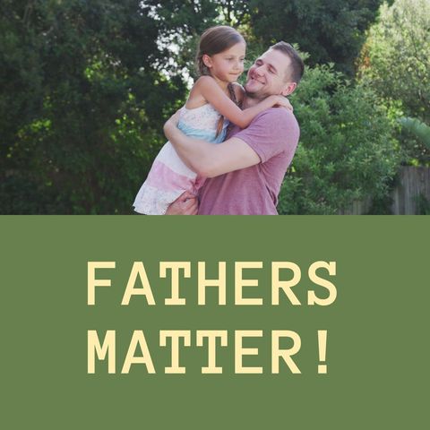 Cheerful Father Holding Daughter in Lush Garden