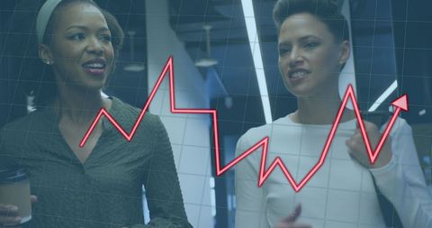 Businesswomen Discussing Work with Rising Graph Overlay - Download Free Stock Images Pikwizard.com