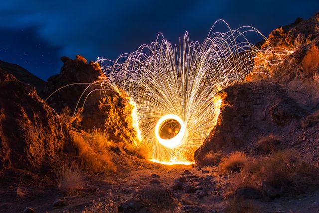 Long Exposure Light Painting with Steel Wool in Desert Canyon at Night - Download Free Stock Photos Pikwizard.com