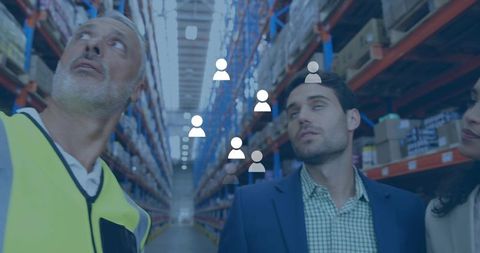 Warehouse team inspecting racks wearing safety vest and blazer with digital workforce icons overlay