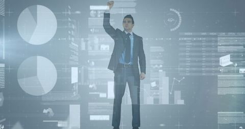 Businessman with Raised Fist Amid Data Projections - Download Free Stock Images Pikwizard.com