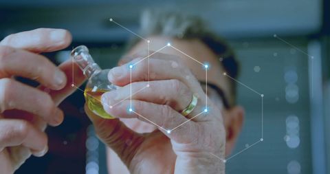 Scientist Analyzing Chemical Sample with Digital Network Overlay