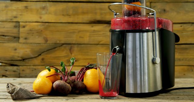 Fresh Juice Making with Modern Juicer, Beets and Oranges on Wooden Table - Download Free Stock Images Pikwizard.com