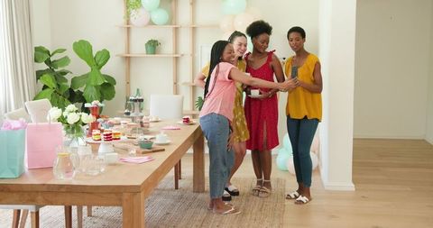 Group of Friends Gathering for Tea Party Celebration at Home