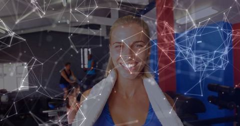 Smiling woman with geometric overlay in modern gym