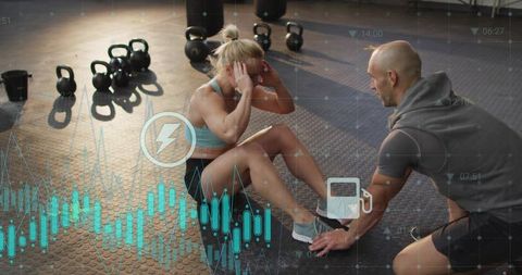 Female athlete doing sit-ups with trainer holding feet and fitness data overlay