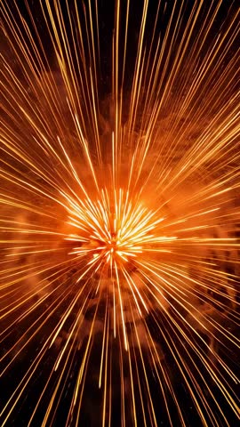 Vertical Firework Starburst Radiating Golden Trails Across Night Sky in Slow Motion