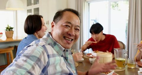 Family Enjoying Meal Together at Kitchen Table