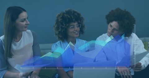 Group of diverse colleagues discussing and analyzing statistical data displayed on a digital chart overlay in a modern office setting. Ideal for illustrating themes of teamwork, technology in business, online data analysis, global communication, and professional business meetings for corporate use and networking projects.