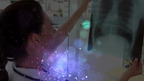 Doctor Analyzing X-Ray with Digital Interface Effects