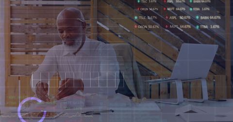 Architect Analyzing Financial Data with Modern Technology