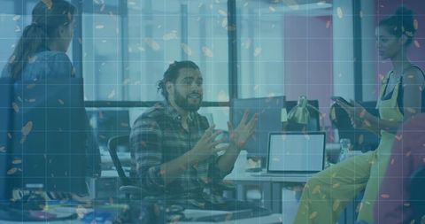 Bearded man gesturing during brainstorming meeting in modern open office workspace
