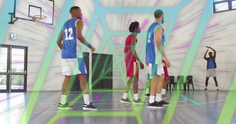 Dynamic indoor basketball team driving to hoop with neon geometric overlay motion blur
