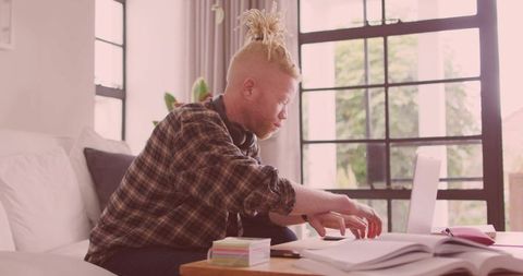 Student Focusing on Studies in Cozy Living Room Setting