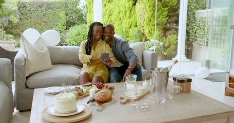 Couple celebrating moment with surprise cake in outdoor setting