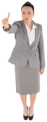Serious asian businesswoman pointing upward on transparent background
