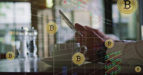 Holding smartphone over coffee while monitoring bitcoin trading charts in cafe