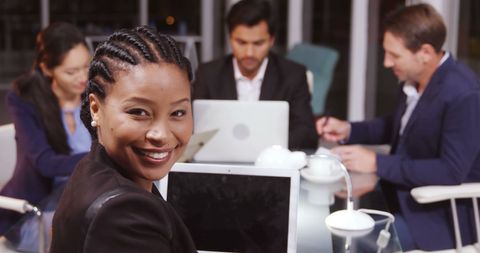 Confident African American Businesswoman in Diverse Team Meeting