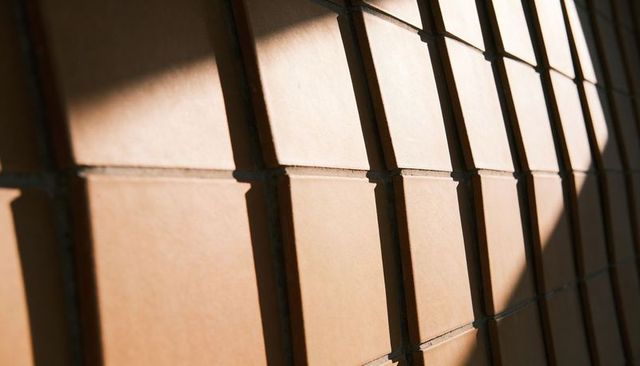 Curved Terracotta Tile Grid Casting Diagonal Shadows, Texture, Geometric Repetition