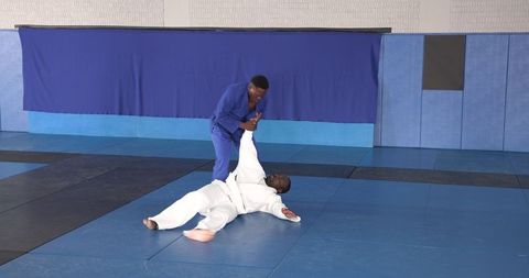 Martial arts training sparring with focus and skill in dojo