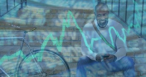 Mature man analyzing mobile data outdoors with chart overlay