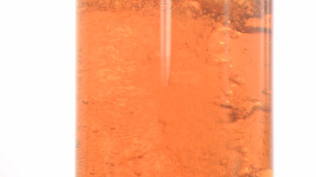 An artistic close-up of a carbonated amber liquid with bubbles against a white background illustrates the vibrant and refreshing quality of the beverage. Ideal for use in marketing campaigns, advertisements, or presentations focused on drink products, refreshment, or any topic related to food and beverages.