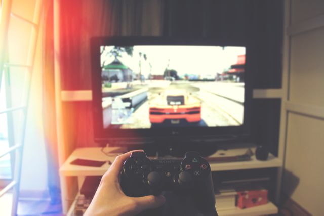 Perfect for use in articles or advertisements promoting gaming culture, video game products, or entertainment technology. Ideal for blogs discussing home entertainment setups or the benefits of gaming for relaxation.