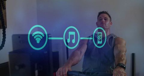 Man Cycling on Exercise Bike Wearing Smartwatch and Hoodie with Holographic Fitness Icons