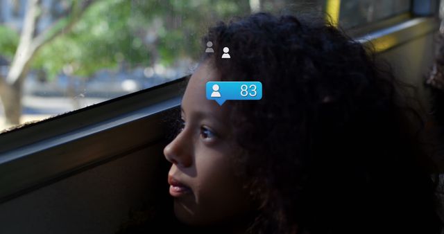 Young girl with curly hair looking out of a window, with social media notification icons superimposed. Representation of digital age, youth online presence, and social network interaction. Suitable for articles about technology's impact on youth, social media engagement, and digital well-being.