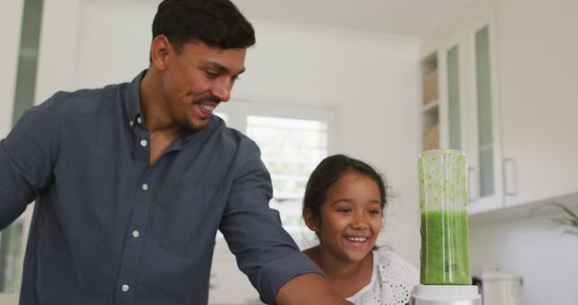 Father and Daughter Preparing Healthy Green Smoothie in Kitchen - Download Free Stock Images Pikwizard.com