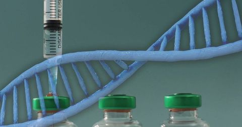 Dna strand and syringe highlighting genetic research