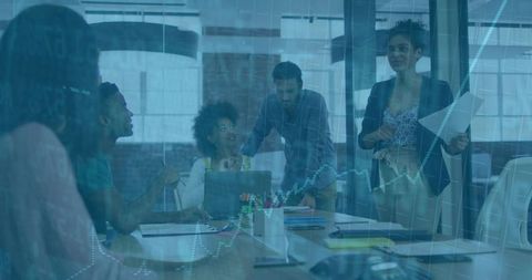Confident Businesswoman Leading Office Meeting with Diverse Team