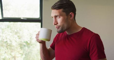 Thoughtful Man Enjoying Coffee Morning at Home