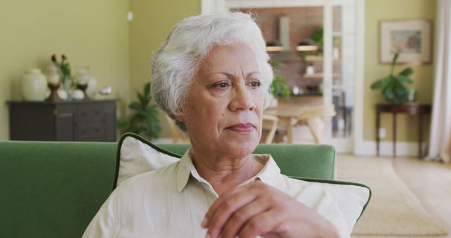 Pensive Elderly Woman Relaxing at Home in Living Room - Download Free Stock Images Pikwizard.com