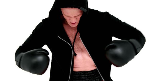 Boxer in Hooded Black Outfit Throwing Powerful Punches - Download Free Stock Images Pikwizard.com