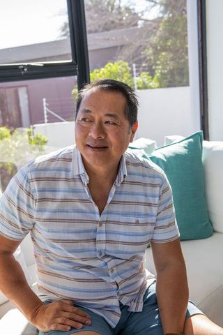 Relaxed Man Enjoying Leisure Time on Sunny Day Indoors