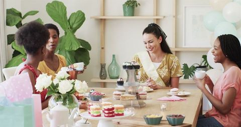 Diverse Group of Women Enjoying Tea Party Celebration