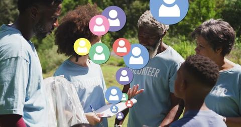 Diverse volunteers discuss eco conservation outdoors