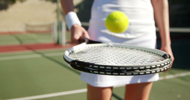 Female Tennis Player Bouncing Ball on Racket - Download Free Stock Images Pikwizard.com