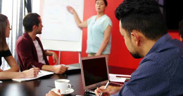 Diverse Team in Office Discussing Strategy During Meeting - Download Free Stock Images Pikwizard.com