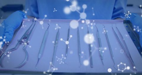 Presenting dental instrument tray with molecular overlay and sterile clinician gloves