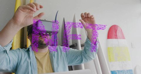 Man Using VR Headset in Surf Shop Surrounded by Surfboards