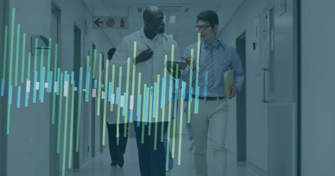 Doctors Discuss Hospital Data Analysis in Hallway Scene