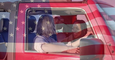 Diverse Women Enjoying Summer Road Trip Under USA Flag
