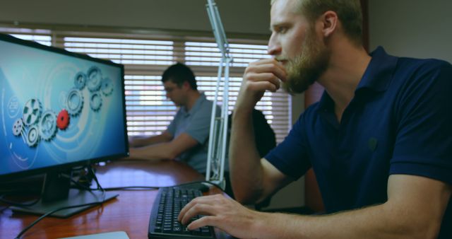 Focused Engineers Working on Computer Projects in Office - Download Free Stock Images Pikwizard.com