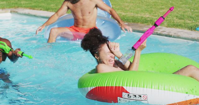 Friends Enjoying Summer Pool Party with Water Guns - Download Free Stock Images Pikwizard.com